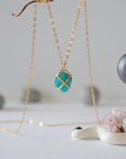 Back view of 14k gold vermeil turquoise necklace showing gold claw prong setting