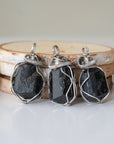 Three raw black tourmaline necklaces for men – shows natural variation in size, shape, and black color of tourmaline stones.