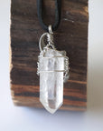 Back view of handcrafted clear quartz point necklace for men – natural stone and wire wrapping, April birthstone, black leather cord.