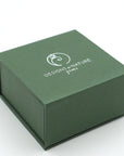 Green jewelry box with 'Designs of Nature' logo on a white background