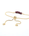 Gold plated brass slider closure on adjustable garnet bracelet showing easy fit mechanism - handcrafted birthstone jewelry