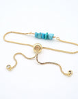 Gold plated brass slider closure on adjustable turquoise bracelet showing easy fit mechanism - handcrafted birthstone jewelry
