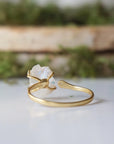 Back view of adjustable ring band in 14k gold vermeil showing open adjustable fit and handcrafted finish on rainbow moonstone ring.