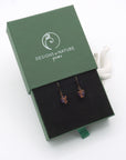 Amethyst drop earrings presented in a branded gift box, ready for gifting, with antique bronze copper wire wrapping.