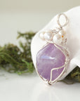 Side angle of handmade amethyst and freshwater pearl pendant necklace, silver wire wrapped jewelry