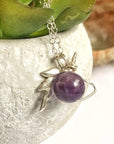 Detailed view of minimalist amethyst unicorn charm necklace, natural 8mm amethyst bead, sterling silver unicorn setting