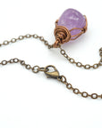 Antique bronze chain clasp closure detail with natural amethyst pendant necklace attached