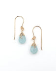 Detailed look at aquamarine drop earrings, genuine faceted aquamarine with minimalist artisan wire wrapping, 14k gold filled, Designs by Nature Gems