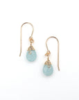 Detailed look at aquamarine drop earrings, genuine faceted aquamarine with minimalist artisan wire wrapping, 14k gold filled, Designs by Nature Gems
