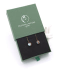 Aquamarine drop earrings presented in a branded gift box, ready for gifting, with antique bronze copper wire wrapping.