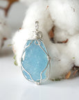 Back view of raw aquamarine pendant, genuine stone with handcrafted sterling silver wire