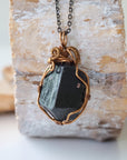 Back view of raw black tourmaline necklace on antique bronze chain, handcrafted pendant by Designs by Nature Gems.
