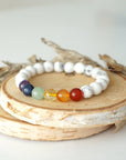Detailed view of chakra beaded stretch bracelet, natural white howlite and 7 chakra gemstone beads, unisex design