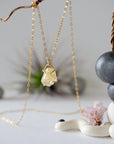 Close up front view of natural citrine crystal wire wrapped in 14k gold-filled - charm necklace pendant detail showing golden gemstone handmade