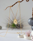 Close up back view of citrine pendant showing 14k gold-filled wire wrapping detail and craftsmanship - charm necklace back side artisan jewelry