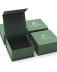 Designs by Nature Gems branded jewelry box packaging for natural moonstone stud earrings, gift-ready June birthstone jewelry.