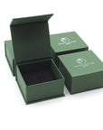 Designs by Nature Gems branded ring box used for packaging a minimalist pearl ring, shown without the ring inside