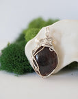 Back detail of silver wire wrapped garnet and freshwater pearl pendant necklace, handcrafted gemstone jewelry