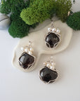 Three silver wire wrapped garnet and freshwater pearl pendants showing natural stone variation, artisan jewelry for women
