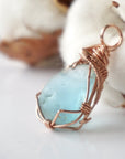 Light blue topaz pendant with a handmade 14k rose gold filled wire wrap and bail