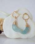 Detailed close-up of Lux Limited Edition Aquamarine Moon Open Circle Stud Earrings on jewelry display, faceted natural aquamarine, 14k gold filled, handmade.