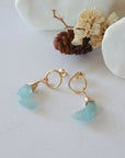 Aquamarine Moon Open Circle Stud Earrings laying flat, 14k gold filled minimalist wire wrap, natural faceted aquamarine, limited edition.