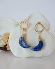 Detailed close-up of Lux Limited Edition Lapis Lazuli Moon Open Circle Stud Earrings on jewelry display, faceted natural lapis lazuli, 14k gold filled, handmade.