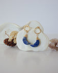 Front angle look at Lux Lapis Lazuli Moon Open Circle Stud Earrings on jewelry display, faceted natural lapis lazuli, gold filled, handmade.