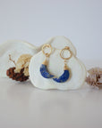 Front angle look at Lux Lapis Lazuli Moon Open Circle Stud Earrings on jewelry display, faceted natural lapis lazuli, gold filled, handmade.