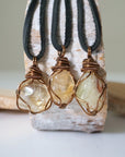 Three natural citrine crystals showing variation in mens necklace pendants - different sizes shapes colors antique bronze wire wrapped unique one of a kind masculine jewelry