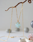Minimalist aquamarine necklace in gold, detailed front view, genuine gemstone in 14k gold vermeil claw setting, Designs by Nature Gems