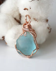 Natural blue topaz pendant hand wire-wrapped in 14k rose gold filled, front view
