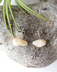 Back view of natural moonstone stud earrings showing 925 sterling silver posts and backs, minimalist June birthstone earrings.
