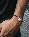 Natural turquoise bracelet on man's wrist, antique bronze wire wrapped unisex leather bracelet, adjustable fit for men