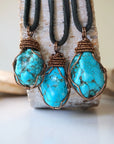 Natural turquoise necklace men showing 3 unique stone variations on leather