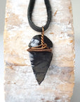 Back view of black obsidian arrowhead pendant with antique bronze copper wire wrap, handcrafted men’s necklace by Designs by Nature Gems.