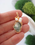 Peridot and freshwater pearl necklace pendant in hand for size reference, artisan birthstone jewelry gift for her