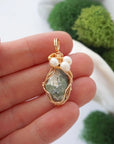 Peridot and freshwater pearl necklace pendant in hand for size reference, artisan birthstone jewelry gift for her
