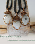 Three rainbow moonstone pendants showing natural variation in size shape and colour in handmade artisan jewelry