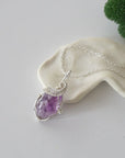 Raw amethyst necklace with 925 sterling silver wire wrapped pendant on silver chain
