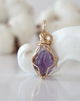Back view of raw amethyst pendant in 14k gold filled, highlighting stone and wire detail. One of a kind February birthstone jewelry by Designs by Nature Gems.