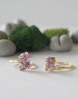 Two raw amethyst rings in 14k gold vermeil showing natural variation in crystal color, shape, and size