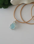 Raw aquamarine necklace for women — handmade 925 sterling silver wire wrapped pendant on genuine tan leather cord, March birthstone, by Designs by Nature Gems
