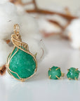 Right side view of raw emerald necklace pendant in 14k gold filled, showing artisan wire wrapping. Handcrafted May birthstone necklace by Designs by Nature Gems.