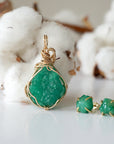 Detailed back view of raw emerald stud earrings in 14k gold filled. One of a kind May birthstone earrings by Designs by Nature Gems.