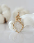 Detailed front view of raw Herkimer diamond pendant in 14k gold filled. Unique wire wrapped April birthstone jewelry by Designs by Nature Gems.