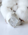 Front view of raw Herkimer diamond pendant for women with detailed artisan wire wrapping in 925 sterling silver.