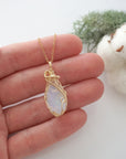 Raw opal necklace in 14k gold filled shown in hand for size reference. Artisan October birthstone pendant by Designs by Nature Gems.