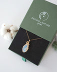 Raw opal necklace in 14k gold filled displayed in branded Designs by Nature Gems jewelry box. Artisan October birthstone gift for women.