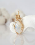 Detailed front view of raw opal pendant in 14k gold filled. Unique wire wrapped October birthstone jewelry by Designs by Nature Gems.